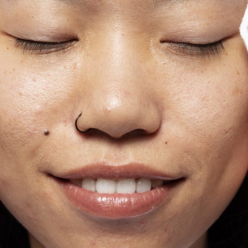 smiley-woman-with-nose-ring-front-view